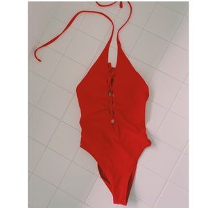 One piece red bathing suit